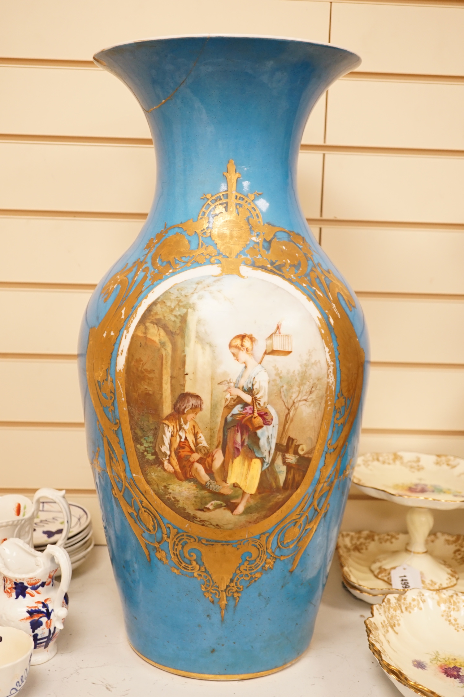 A large 19th century Sevres style blue porcelain decorated vase, 65cm (a.f.)